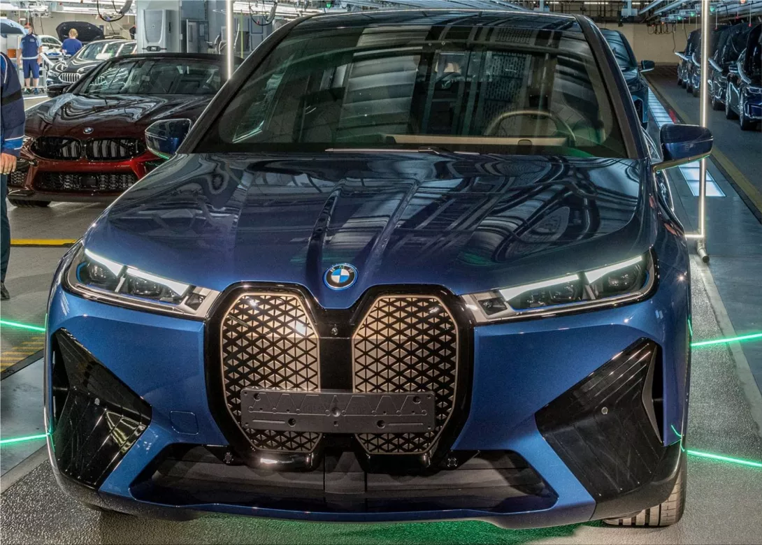 The new BMW iX electric SUV in Phytonic Blue Metallic EV stories